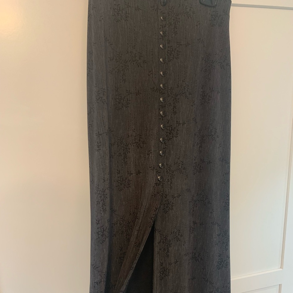 Small long grey skirt.